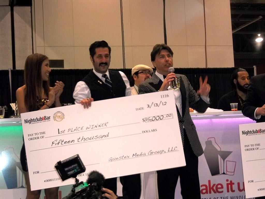 Josh Harris winning 1st place check of $15,000 at the 2012 Shake It Up! cocktail competition.