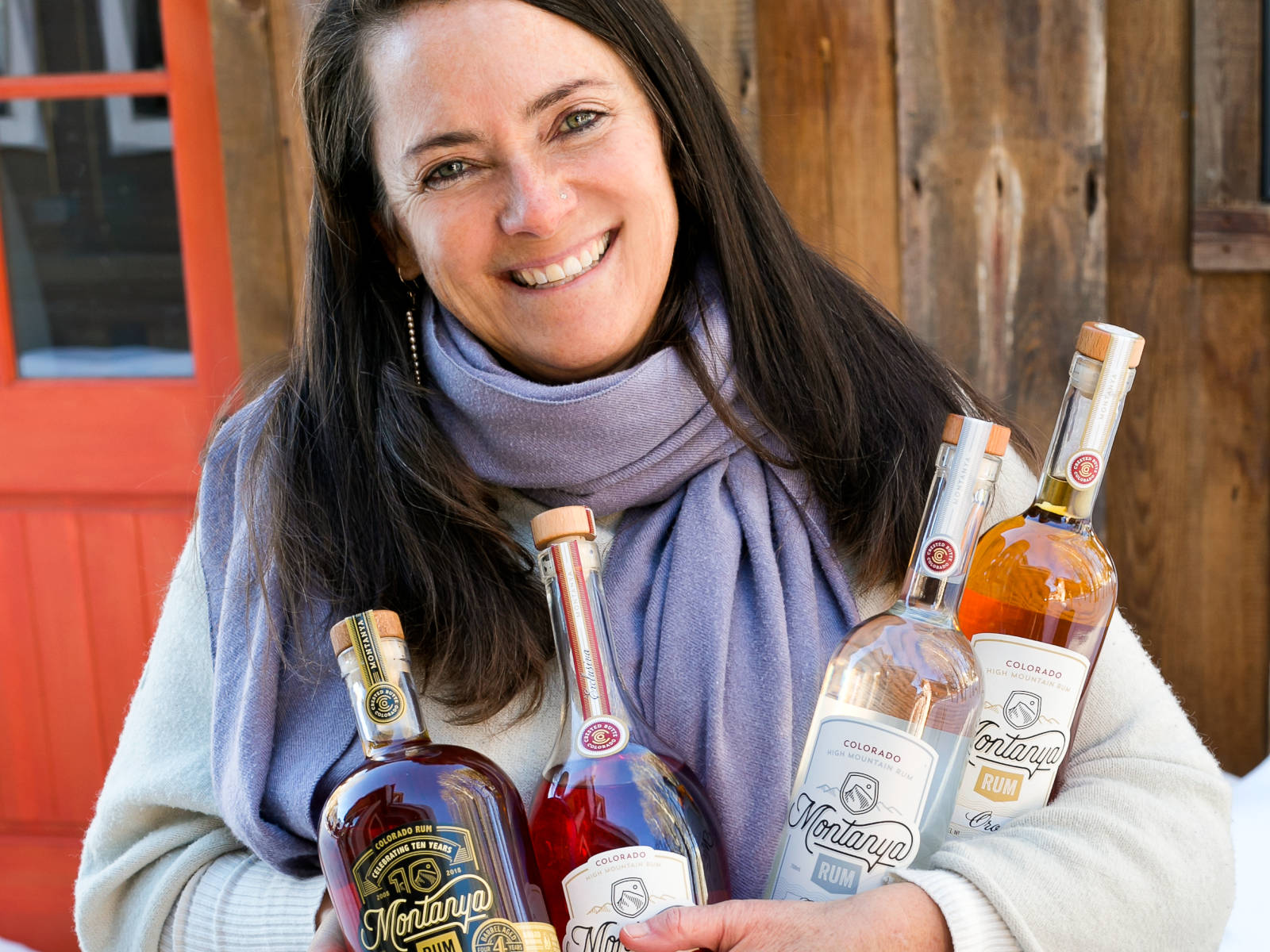Karen Hoskin of Montanya Distillers, with four Montanya Rum expressions