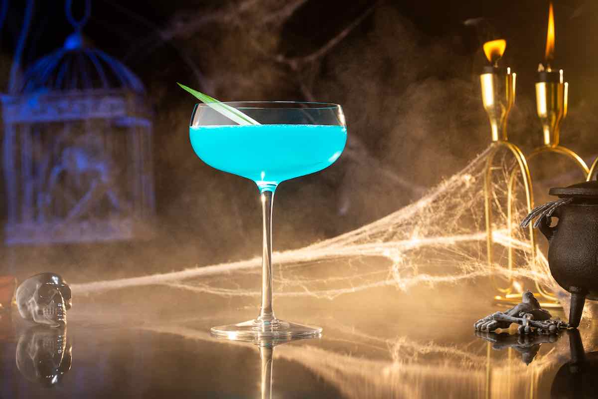 blue-colored Viper Reviver Halloween Cocktail in a coupe glass