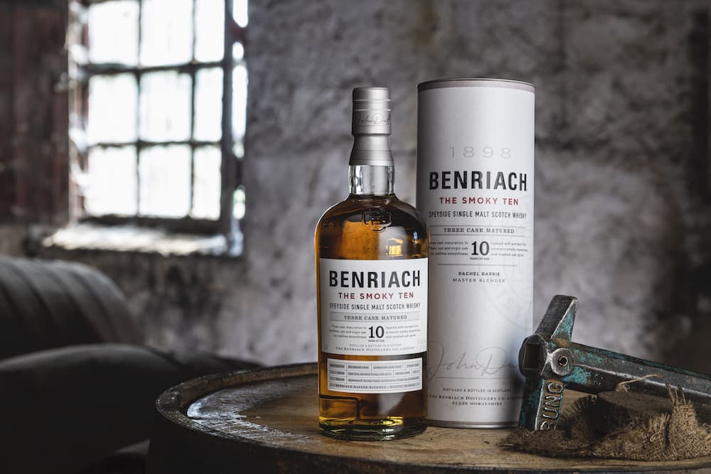 benriach smoky 10 scotch whisky bottle sitting on a barrel