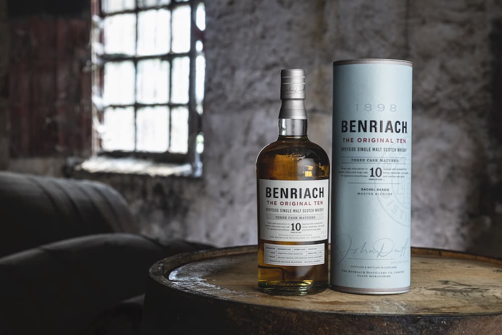 benriach original 10 scotch whisky bottle sitting on a barrel