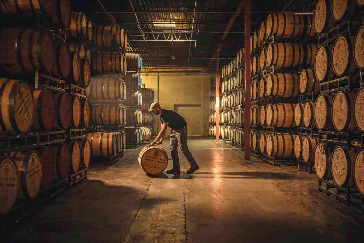 colorado distillery warehouse with whiskey barrels