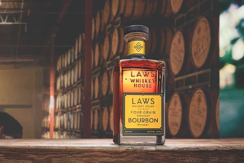 a bottle of Laws Whiskey House four grain bourbon 