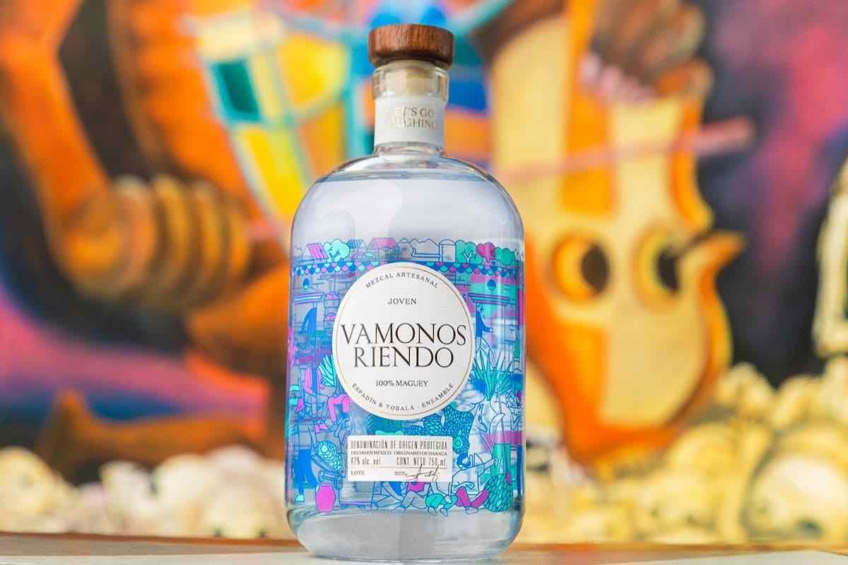 Vamonos Riendo mezcal bottle with colorful mural