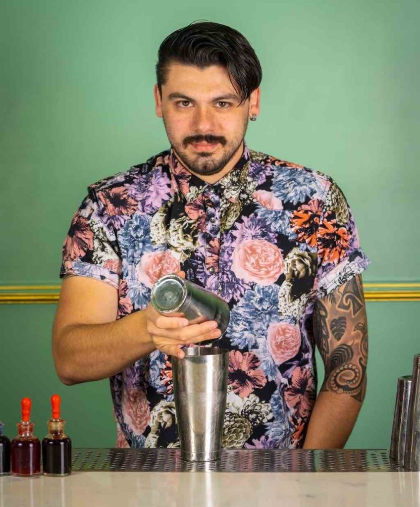 will isaza bartender makes a cocktail at blossom bar.
