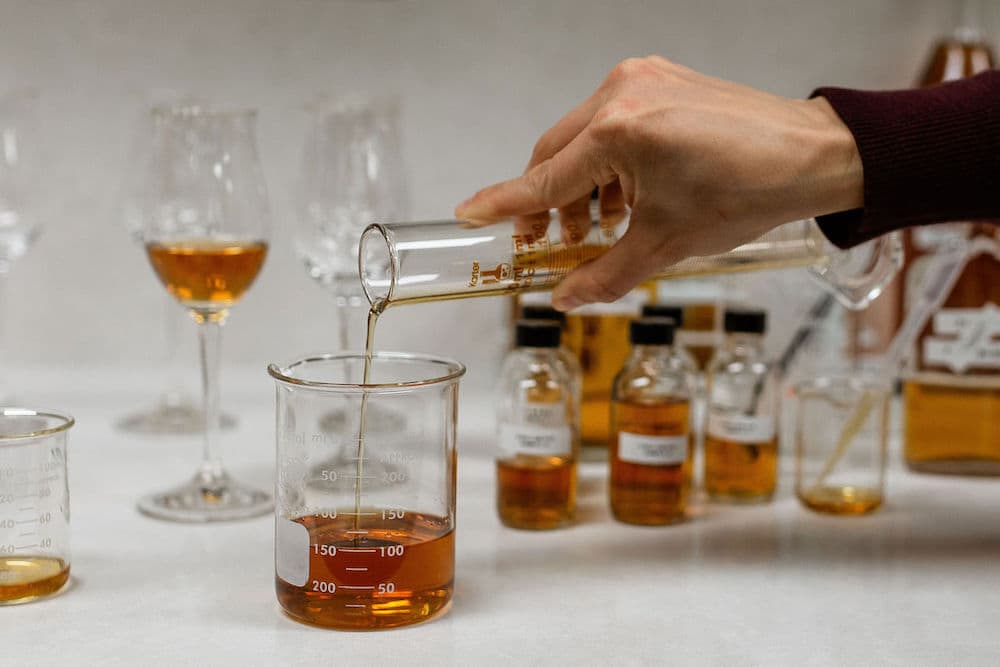 blending barrell whiskey in beakers