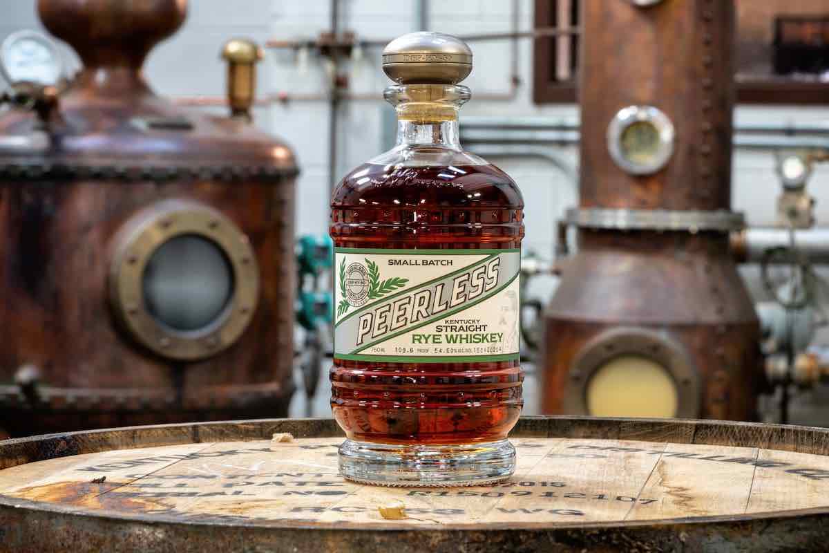 peerless rye whiskey bottle on a barrel