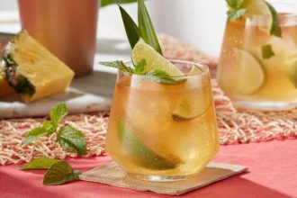 Pineapple Lime Smash cocktail with mint and lime garnish