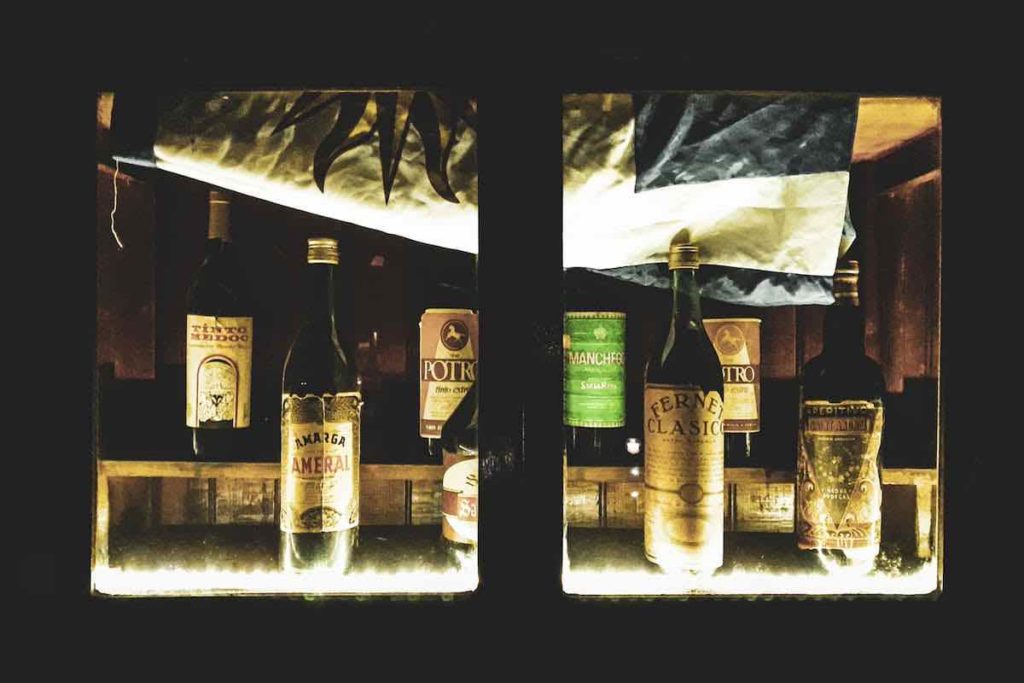 display window with old liquor bottles