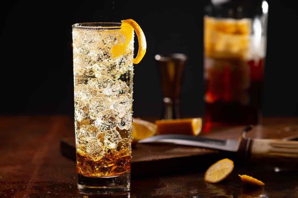 Japanese Highball cocktail garnished with an orange