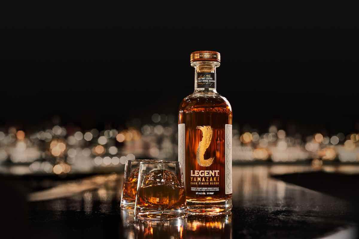 a bottle of legent yamzaki cask finish whiskey with two glasses