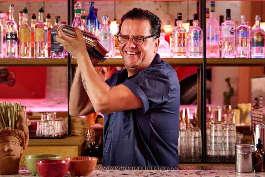 nacho jimenez shakes a cocktail at superbueno